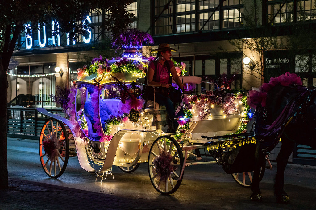 Horse and carriage driving through San Antonio